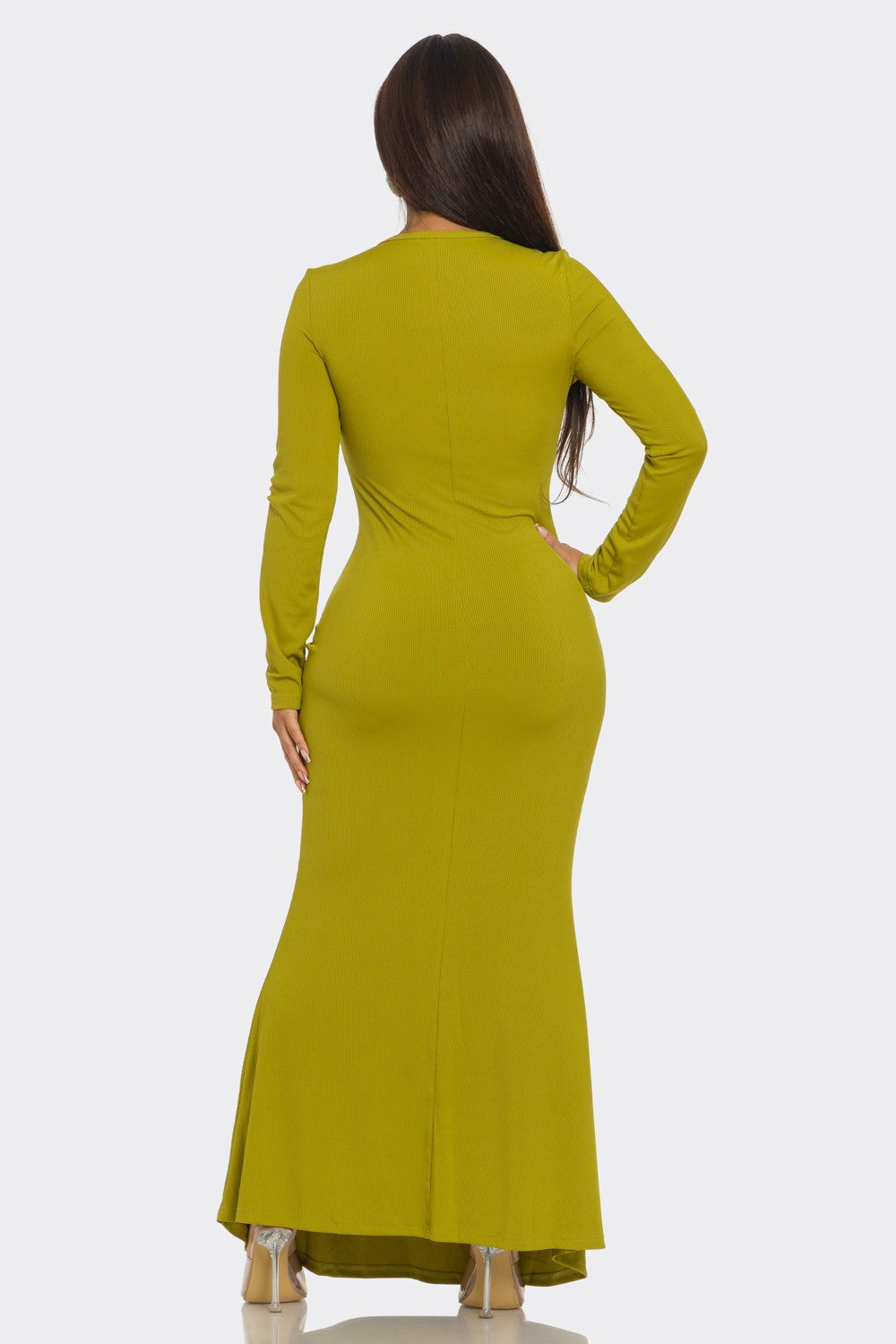 A woman modeling a long-sleeve, floor-length olive green dress from the back, shown against a plain light gray studio background.